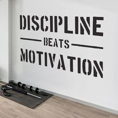 there is a wall decal that says discipline beats motivation