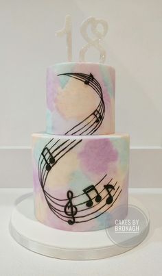 two tiered cake with musical notes on it