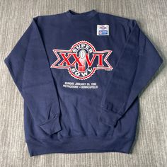 a blue sweatshirt with an image of a skull on the front and words in red