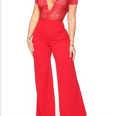 Red Lace Jumpsuit Low Cut Wide Leg Top Half Is See Through Never Worn Red Fitted V-neck Jumpsuit, Red V-neck Bodysuit For Spring, Spring Red V-neck Bodysuit, Elegant Red Stretch Jumpsuits And Rompers, Chic Red Short Sleeve Jumpsuits And Rompers, Red Jumpsuits And Rompers For Night Out, Chic Red Bodysuit For Date Night, Red Fitted V-neck Jumpsuits And Rompers, Elegant Red Jumpsuits And Rompers For Date Night