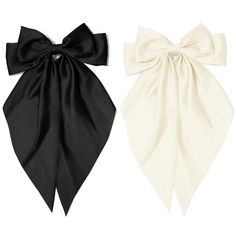 two black and white bow ties on a white background