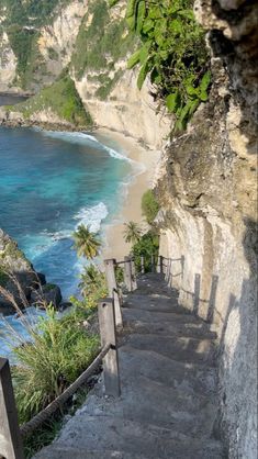 stairs lead down to the beach and ocean