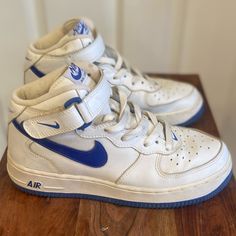 -2002 Nike Air Force 1 306603 141 -Mid White With Royal Blue -Us Size 6y Converts To Women 7.5 -These Sneakers Have Been In Storage Since 2004 -My Daughter Bought These When She Was In High School And Working At Foot Locker Part-Time -These Sneakers Are In Top Excellent Condition! -No Scuffs. Leather Shows No Signs Of Wear Or Tear -Original Shoe Laces -Made In Vietnam Vintage Nike Blue Sneakers, Vintage Blue Nike Sneakers, Nike Vintage High-top Sneakers With Round Toe, Vintage Nike High-top Sneakers With Round Toe, Vintage Blue Sneakers With Round Toe, Blue Air Force 1, Nike Air Force Mid, Royal Blue Color, In High School