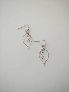 "These simple leaf shaped wire earrings are super simple and will compliment just about any outfit! 100% stainless steel wire and earring hooks. They hang approximately 1.25\" down from earring hook. Earrings will come on an earring card with plastic earring backs. All my jewelry is handmade, and made with patience, care and love. In the unlikely event that it needs to be repaired, I'll do it free of charge." Nickel Free Leaf-shaped Metal Earrings, Nickel-free Leaf-shaped Metal Earrings, Nickel-free Metal Leaf-shaped Earrings, Minimalist Nickel-free Leaf-shaped Earrings, Handmade Leaf-shaped Metal Earrings, Nickel-free Metal Leaf Earrings, Handmade Metal Leaf-shaped Earrings, Wire Leaf, Citrine Earrings Studs