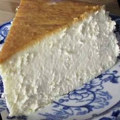 a piece of cheesecake on a blue and white plate with the words i need 20 people to please say yes if you see this post thanks