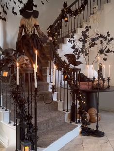 a staircase decorated with halloween decorations and candles