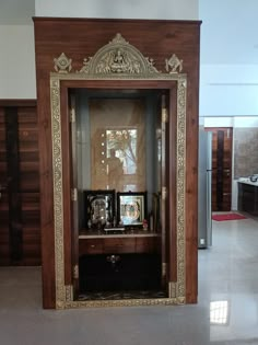 an ornate mirror in the middle of a room