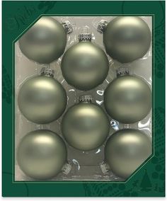 six shiny silver christmas ornaments in a package