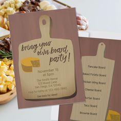 two wooden cutting boards sitting next to a bowl of food on a white counter top