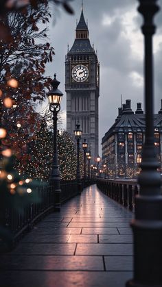 the big ben clock tower towering over the city of london at christmas time in england