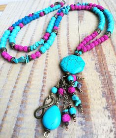 Bohemian tassel beaded necklace made with turquoise beads, turquoise  chips, pink lava beads, hand made beaded tasell,  brass charms. One-of-a-kind colorful bohochic long necklace You can wear on any ocasion. Go well specially in summer time. Hand made tassel make this item a little boho - hippy. Summer and turquoise go great together. It is wearable of course all year round. I'm sure you'll love to wear this unique peace of jewerly. Dimensions: -boho necklace is 55 cm long(with pendant) Thank y Affordable Bohemian Turquoise Necklace With Beaded Chain, Bohemian Beaded Necklaces With 8mm Beads For Jewelry Making, Bohemian Hand-strung Turquoise Necklace For Festivals, Handmade Adjustable Bohemian Tassel Necklace, Bohemian Tassel Necklace With Colorful Round Beads, Bohemian Beaded Turquoise Necklace For Meditation, Bohemian Tassel Necklace With Colorful Beads, Adjustable Bohemian Tassel Necklace With Colorful Beads, Bohemian Turquoise Necklace With 108 Beads For Gift