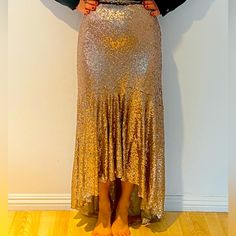 These Champagne Micro Sequins Create The Most Luminous Look At Your Big Event! The Mermaid Cut Allows For So Much Graceful Movement As You Stride And Glide Through Your Evening! You’ll Definitely Feel Magical In This Gorgeous Piece! Glamorous Gold Long Skirt, Glamorous Long Gold Skirt, Gold Flowy Party Skirt, Gold Long Skirt For Night Out, Fitted Gold Maxi Skirt For Night Out, Gold Long Skirt For Evening, Gold Flowy Skirt For Party, Fitted Gold Long Skirt, Fitted Gold Lined Maxi Skirt