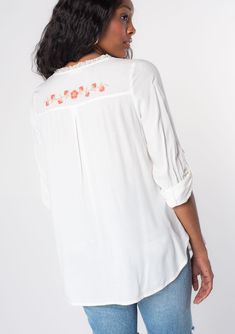 Looking for a Spring wardrobe refresh? This simple yet refined long sleeve bohemian blouse features a delicate self-covered button front, flattering split v-neckline, and floral embroidered detail. Wear it loose over denim, or try it tied in the front. Vintage floral embroidery Relaxed fit Long rolled sleeve with button tab closure Rounded hemline Side vents V-neckline Lace trim Self-covered button front Can be tied at the front Bohemian top Model is 5'9, wearing a size S.Style: I-13797W-RPX Feminine Embroidered V-neck Blouse, Spring Flowy Blouse With Split Neck, Relaxed Fit V-neck Embroidered Top With Floral Embroidery, Relaxed Fit V-neck Top With Floral Embroidery, Flowy Split Neck Blouse For Spring, White Bohemian Blouse With Button Closure, White Henley Neckline Top For Spring, Long Sleeve Embroidered Top For Spring Daywear, Feminine Long Sleeve Rayon Blouse