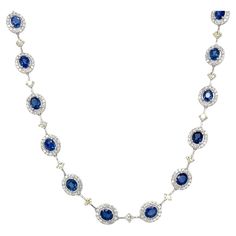 This spectacular blue sapphire and diamond Riviera necklace epitomizes luxury, class and style! The 24 beautifully matched oval sapphires weigh over 12 carats total and possess quintessential cornflower blue color that connoisseurs think of when they envision the finest sapphires! Each gem is set in 18k white gold with its own sparkling white diamond halo, then linked together in an exquisite design accented by light lemon yellow diamonds. This stunning necklace was designed to be flexible so it Light Lemon Yellow, Riviera Necklace, Gold Drapes, Yellow Diamonds, Ring Pendant Necklace, Stunning Necklace, Cornflower Blue, Lemon Yellow, Yellow Diamond