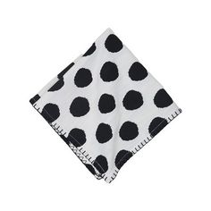 a black and white polka dot print napkin