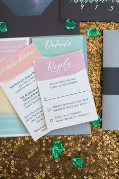 the wedding stationery was done in shades of pink, green and gold