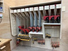 tools are stored on shelves in a workshop