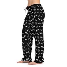 "Introducing our \"Bats and Bones\" Print Pajama Pants for Women, a stylish and comfortable choice for those who embrace the dark side with a touch of mystery. These pajama pants feature a captivating design with bats and bones, perfectly capturing the essence of the gothic aesthetic. Crafted with soft and breathable fabric, they offer both coziness and style for a restful night's sleep. Embrace your unique sense of fashion and indulge in the dark charm of these pajama pants. Whether worn for lo Wide Leg Pants With Elastic Waistband For Bedtime, Black Pants With Elastic Waistband For Sleepover, Black Elastic Waistband Pants For Sleepover, Cotton Long Pants For Home, Black Bottoms For Sleepover, Black Long Pants For Pajama Party, Pajama Pants Outfit, Matching Pajama Pants, Matching Pajama