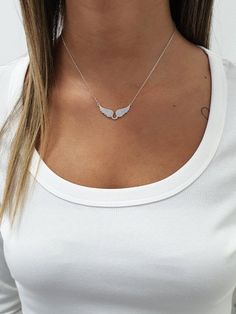 "Handmade rose gold over sterling silver angel wings pendant necklace set with cz zircons, making a simple but elegant statement. The perfect layering piece or minimalist necklace. This necklace is perfect to wear as everyday jewelry and combined layered with other necklaces. Hypoallergenic, lightweight and minimalist. ► FEATURES: * Rose gold plate over sterling silver wings cz pendant necklace. ► MEASUREMENT : Chain length: 15.7\" / 40 cm Pendant width: 1.37\" / 3.5 cm Pendant height: 0.59\" / Angel Wings Pendant, Wings Pendant, Gold Angel Wings, Silver Angel Wings, Angel Wing Necklace, Angel Wing Pendant, Layered Necklaces Silver, Silver Wings, Wing Necklace