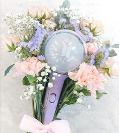 a bouquet of flowers with an electric toothbrush in it