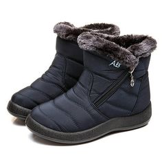 a pair of black snow boots with zippers