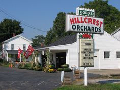 a white building with a sign that says hillcrest orchards on it's front