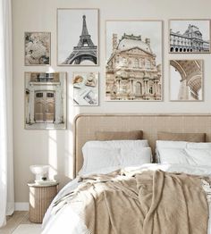 a bedroom with pictures on the wall above the bed