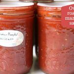 two jars filled with homemade marinara sauce