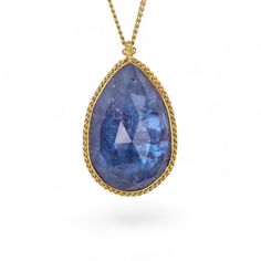 Tanzanite necklace on white Handmade Yellow Gold Sapphire Jewelry, Formal Briolette Sapphire Necklace, Teardrop Tanzanite Jewelry In Yellow Gold, Yellow Gold Oval Pendant Necklace, Gold Tanzanite Teardrop Jewelry, Yellow Gold Briolette Sapphire Necklaces, Elegant Gold Tanzanite Necklace, Elegant Faceted Sapphire Necklaces, Formal Gold Necklace With Large Stone