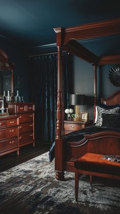 a bed room with a neatly made bed and dressers