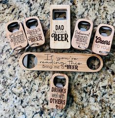 six wooden bottle openers with different sayings on them