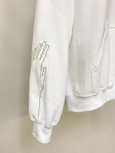 HANDS Embroidered Hoodie. Hands design illustrated, digitized, and embroidered by HAMR Studio in Los Angeles, CA. White sweatshirt, green thread. Unisex small. Images of black hoodie are included for fit. Small Images, Hands Design, Green Thread, Embroidered Hoodie, Hand Designs, White Sweatshirt, Black Hoodie, Hand Embroidered, Sweat Shirt