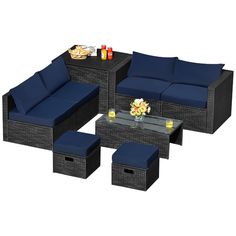 an outdoor furniture set with blue cushions