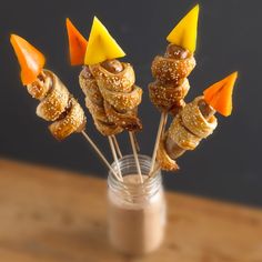 some food sticks are sticking out of a jar