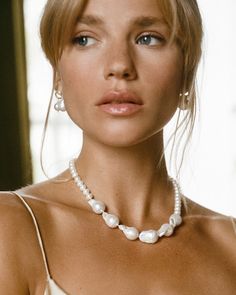 Perfection is boring, we prefer something more unique - just like you & this pearly little number. The Champagne Necklace combines smaller Keshi pearls with the organic forms of bold baroque pearls, to create an elegant yet modern piece of art.

Take centre stage & wear the Champagne Necklace as a standalone statement or pair with our teardrop-shaped Pamplona Earrings for a look as bold as your beautiful heart. 
Details

Handcrafted in a thick layer of 18k gold on sterling silverChain length: 42 Champagne Necklace, Fair Trade Jewelry, Pre Black Friday, Recycled Jewelry, Pamplona, Keshi Pearls, Sustainable Jewelry, Freshwater Cultured Pearls, Unique Gemstones