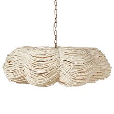 a white chandelier hanging from a chain