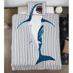 a bed with a shark print on it