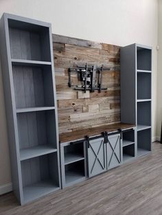 an entertainment center made out of wood and metal