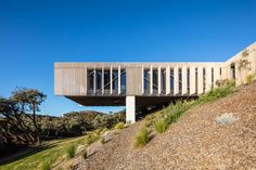 a wooden structure on top of a hill