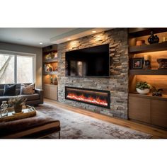 a living room filled with furniture and a flat screen tv mounted on the wall above a fire place