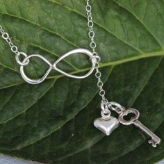 "Sterling Silver Infinity Key heart Necklace The picture length is 17\", it could be shorter or longer , depend on customer request. It consists of... -Sterling Silver key charm, -Sterling Silver Heart charm, -Sterling Silver Infinity link, and -Sterling silver chain with spring claw. -Come up with small ribbon gift Box , pr-made Massage Card as well and -One set of care instruction package . MORE HEART NECKLACES https://www.etsy.com/shop/rainbowearring/search?search_query=heart+&order=date_ Adjustable Sterling Silver Infinity Necklace, Sterling Silver Dangle Lariat Necklace For Gift, Minimalist Sterling Silver Lariat Necklace As A Gift, Silver Sterling Silver Lariat Necklace As Gift, Adjustable Sterling Silver Charm Necklaces For Valentine's Day, Valentine's Day Adjustable Sterling Silver Charm Necklaces, Adjustable Lariat Necklace With Heart Charm As Gift, Adjustable Lariat Necklace With Heart Charm For Gift, Adjustable Sterling Silver Lariat Necklace For Anniversary