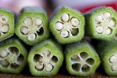 the inside of a green plant with white flowers