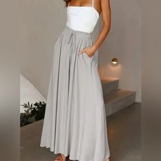 These Plus Size, Lace-Up, Wide-Leg Pants Are Perf For Spring And Summer. The Lace-Up Front Is A Stylish Touch, And The Pants Are Loose And Comfy. Throw On A Tank Top, T-Shirt, Or Blouse, And You're Ready To Take On The Day. Gray Lace Up Wide Leg Pants Casual Loose Pants For Spring & Summer, Women's Plus Size Size Oxl/12 Waist: 33.9-36.2inhips: 43.7-46.1in Bottom Length 40 Inseam 27.5 Color Gray Material: Polyester Style: Vacation Operation Instruction: Machine Wash Or Professional Dry Clean Seas Elegant Vacation Bottoms Solid Color, Elegant Solid Color Vacation Bottoms, Gray Bottoms For Spring Vacation, Gray Wide Leg Pants For Summer, Summer Gray Wide Leg Pants With Pockets, Gray Wide Leg Pants With Pockets For Summer, Bohol, Hannah Montana, Mini Robes