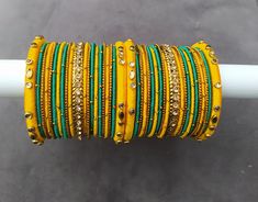 Hey lovely people!! This is a lovely combo of silk thread metal bangles. Accompanied by silk thread kadas embellished with faux kundans which provides a simple, smart and minimalist look to the set. The centre antique gold metal bangles adds that glam to the set. They will be with white or gold stoned depending on the availability. I have posted only few colours but many more colours are available and can be customized in any colour you like so please do send me a convo to discuss your customisa Haldi Bangles, Pakistani Bangles, Metal Bangles, Bangles Indian, Make An Effort, Silk Thread, Color Combos, Antique Gold, Gold Metal