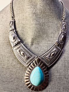 Southwestern style Native American style Very substantial Bib statement necklace  Silver tone Faux turquoise cabochon Total length 22" 3" extender Bohemian Silver Turquoise Cabochon Necklace, Silver Bohemian Turquoise Cabochon Necklace, Nickel-free Bohemian Turquoise Metal Necklace, Bohemian Turquoise Cabochon Necklace, Bohemian Nickel-free Turquoise Metal Necklace, Bohemian Nickel-free Turquoise Necklace, Bohemian Metal Necklaces With Cabochon, Bohemian Metal Necklace With Cabochon, Native American Style