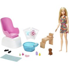 a barbie doll plays with her baby's furniture and toys including a potty chair