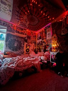 a bedroom decorated with lights and pictures on the wall