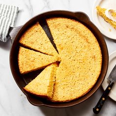 a cake in a pan with slices cut out