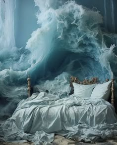 an ocean themed bedroom with waves crashing over the bed