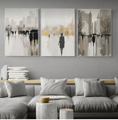 a living room with two paintings on the wall